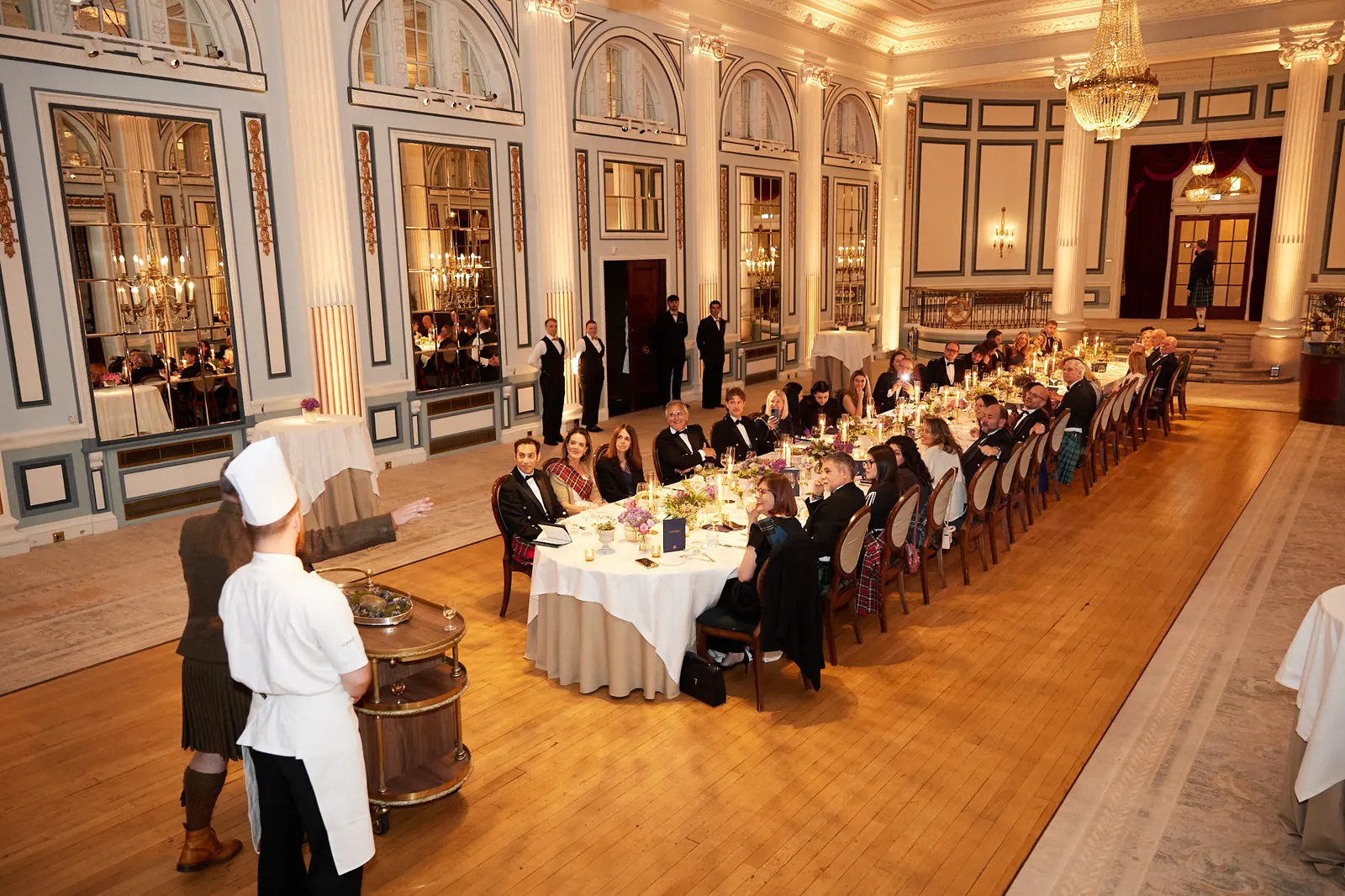 Chef presenting the haggis to guests at a corporate dinner in the Gleneagles ballroom