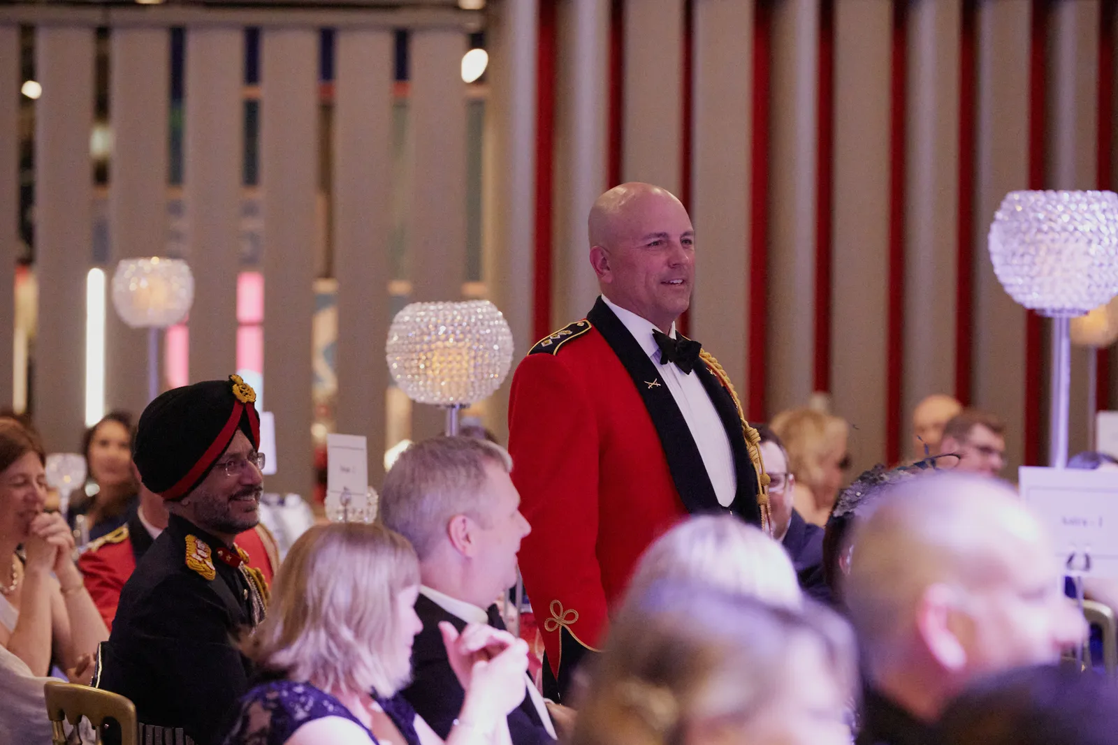 Guests in evening dress at a gala dinner
